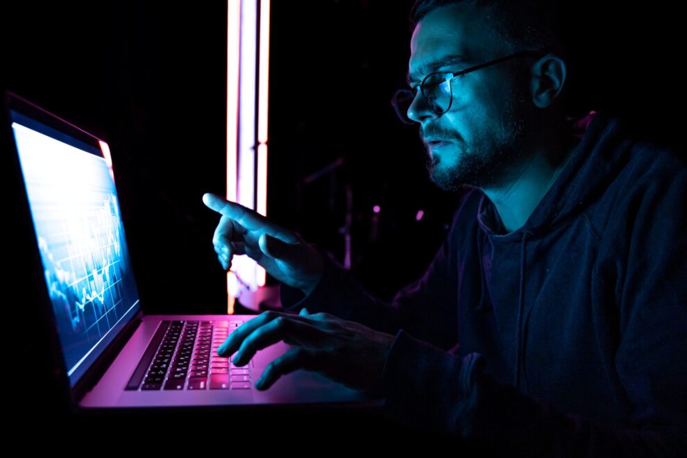 man-analyzing-stock-market-charts-financial-data-electronic-board